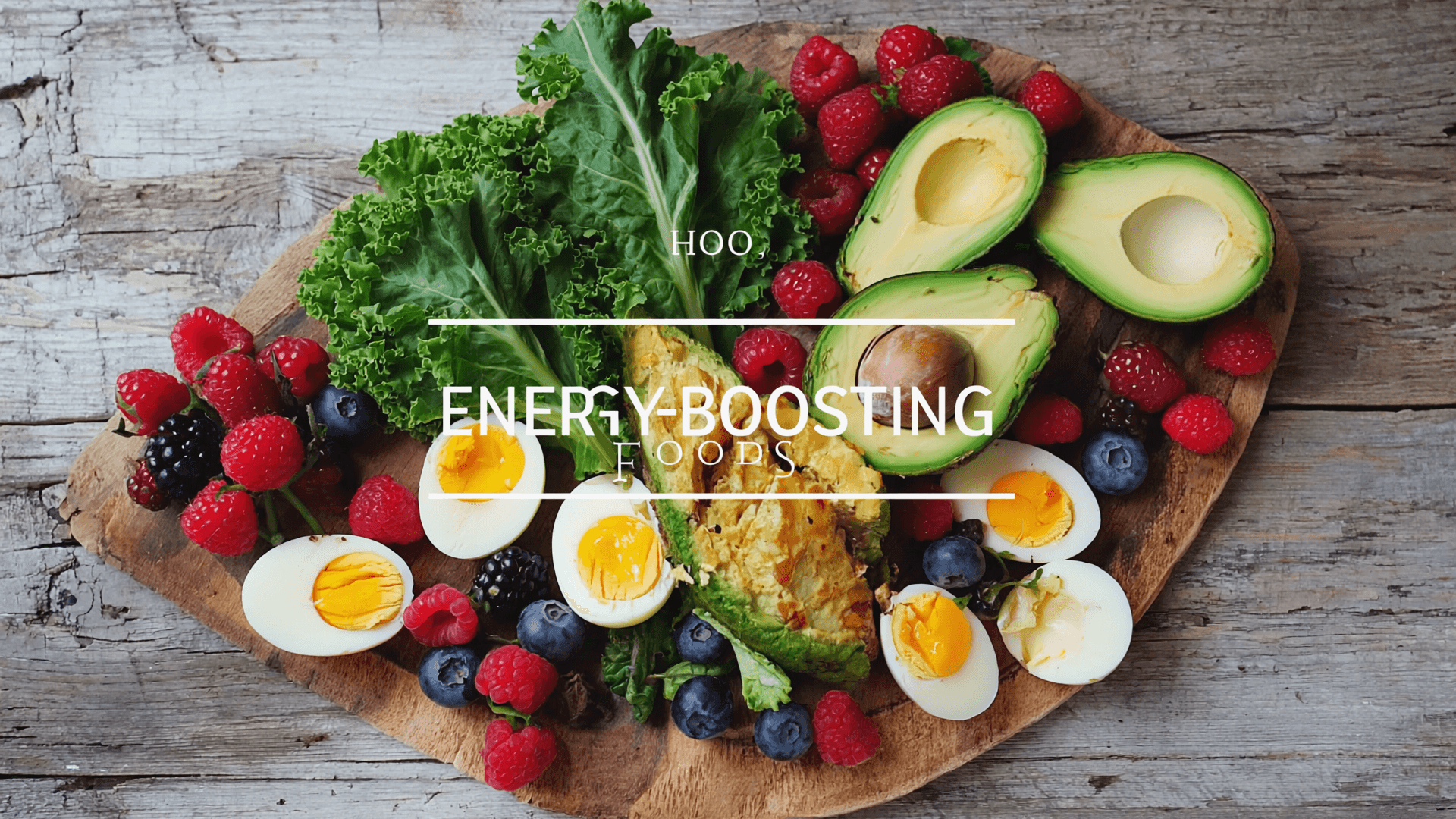 A colorful spread of energy-boosting foods including avocado, berries, eggs, and leafy greens on a wooden table