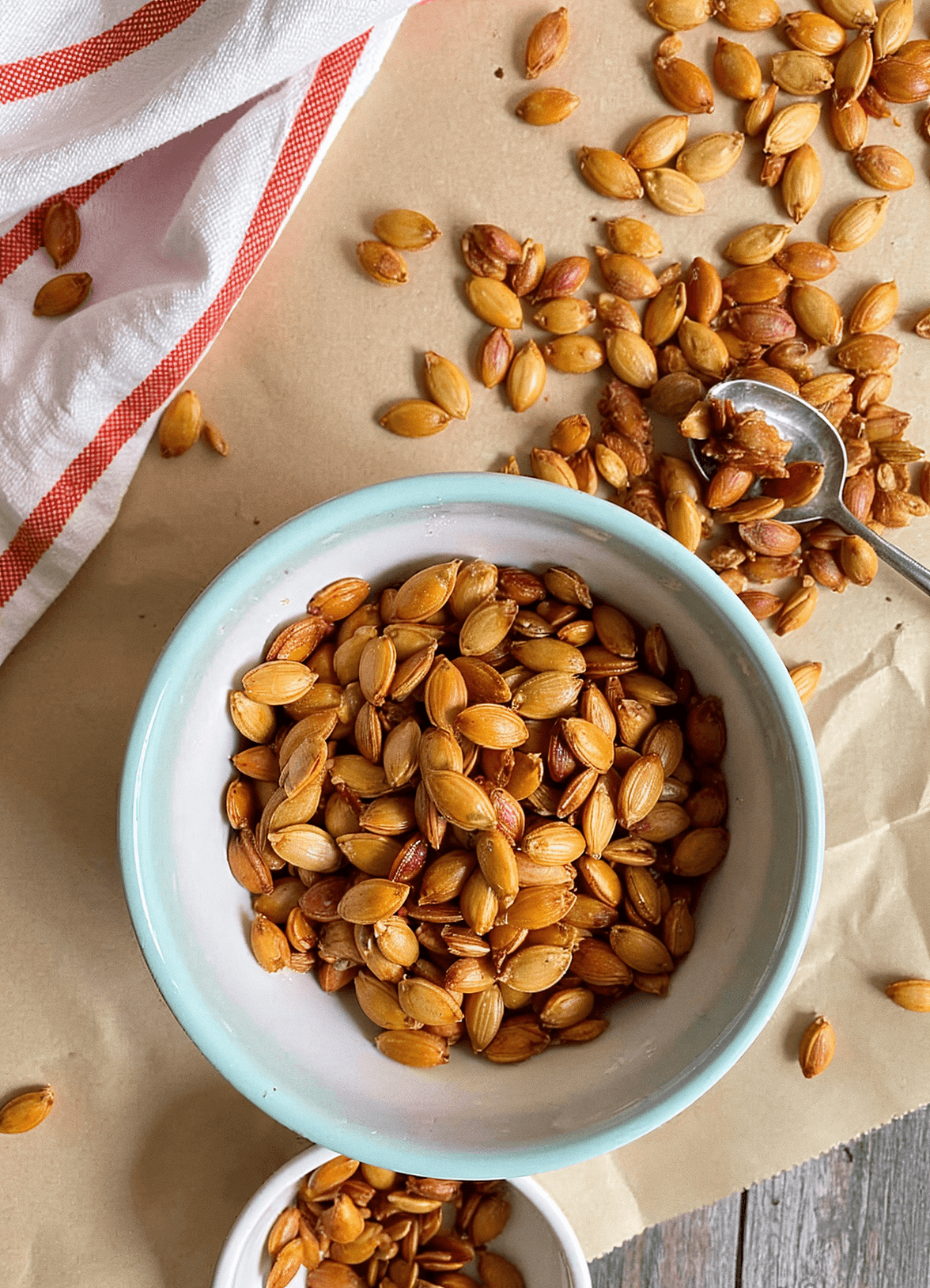 Roasted pumpkin seeds in a small bowl, offering a crunchy and nutritious snack.